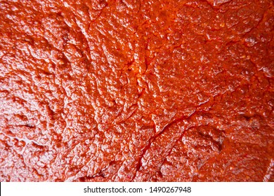 Top View Of Orange And Red Hot Spicy Sauce With Chili Curry Menu And Spices Float Up During Boiling For Use Be Background And Texture.