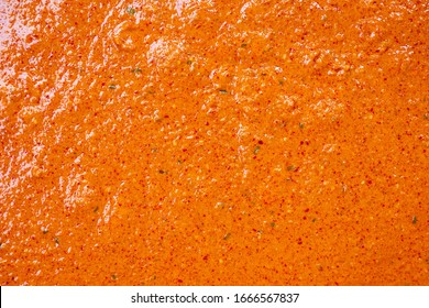 Top View Of Orange And Red Hot Spicy Sauce With Chili Curry Menu With Spices Finely Ground For Use Be Background And Texture.