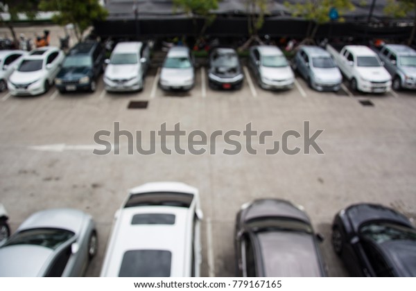 Top view outdoor parking of\
department stores, Outdoor parking, Car park, Blurred\
background.