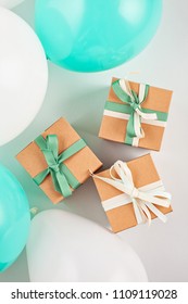 Top view over the gift boxes with ballons and party decoration. Parties and celebration concept
