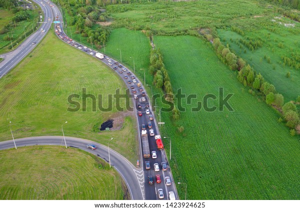 Top\
view over the highway, aerial view interchange of a city, Shot from\
drone, Expressway is an important\
infrastructure.