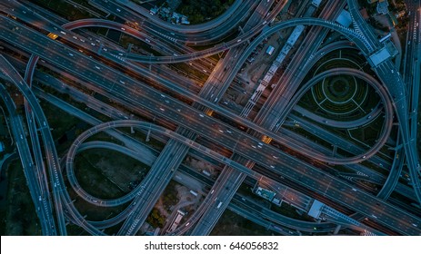 Top view over the highway, expressway, motorway in the city at night, Aerial view interchange of a city.