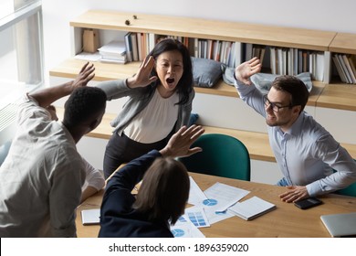 Top View Overjoyed Middle Aged Korean Female Leader Giving High Five To Laughing Young Diverse Colleagues At Office Meeting, Celebrating Corporate Success Or Important Company Achievement Together.