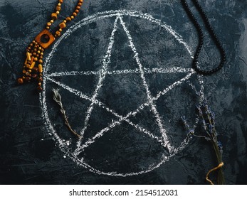 Top View Of A Painted Pentagram For A Ritual And An Ancient Amulet