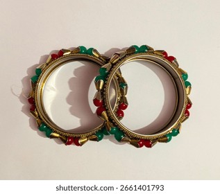 Top view of a pair of beaded bangles isolated on white background.