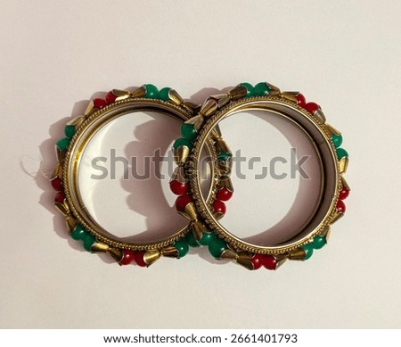 Top view of a pair of beaded bangles isolated on white background.