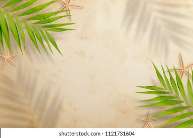 Top View Of Palm Leaves With Shade And Starfish On Beach Sand Background. Flat Lay. Travel Concept, Empty Space For Text