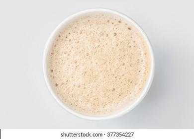 top view of paper cup takeaway mix latte coffee foam, white background