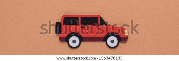 top view of paper cut car on brown background,\
car rent concept
