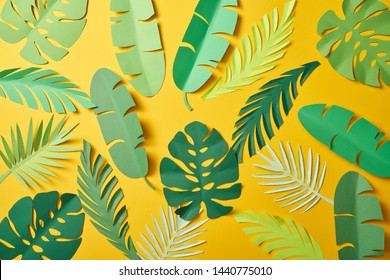 Top View Of Paper Cut Green Palm Leaves On Yellow Background, Seamless Pattern