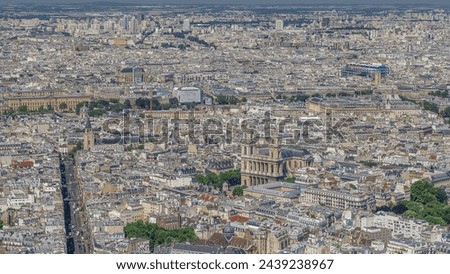 Top view of Paris skyline from above timelapse. Landmarks of european megapolis with Church of Saint-Sulpice. Bird-eye view from observation deck of Montparnasse tower. Paris, France