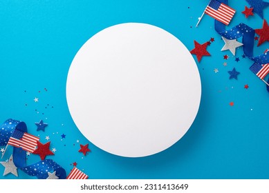 Top view party accessories, such as stars, national flags, confetti, serpentine are artfully arranged on blue backdrop with empty circle, setting stage for vibrant Independence Day USA celebration - Shutterstock ID 2311413649