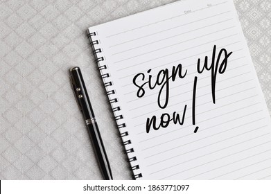 Top view of pen and notebook written with text SIGN UP NOW!. Business and education concept.  - Powered by Shutterstock