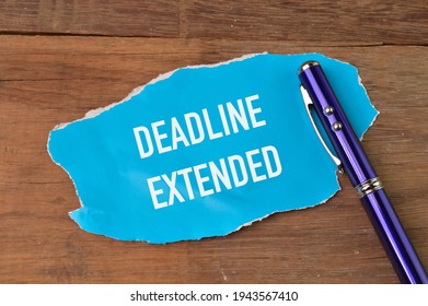 Top view of pen and torn paper written with DEADLINE EXTENDED. - Shutterstock ID 1943567410
