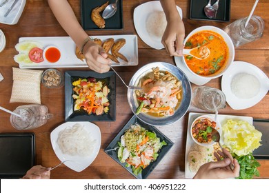 Top View Of People Eating Thai Food Together.