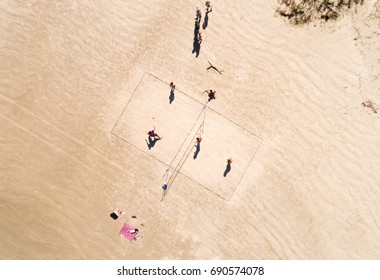 Top View People Playing Volleyball in a beach in Brazil - Powered by Shutterstock