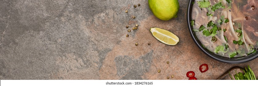 Top View Of Pho In Bowl Near Lime, Chili On Stone Background, Panoramic Shot