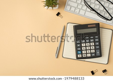 Top view photo of flowerpot glasses on keyboard calculator on grey copybook pen and binders on isolated beige background with copyspace
