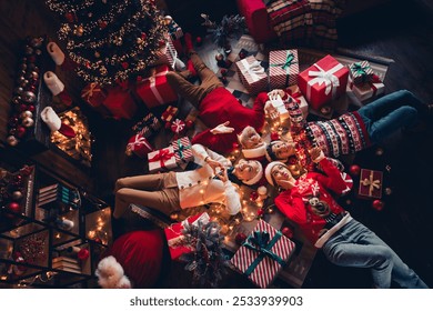 Top view photo of happy family celebrate new year lying grandson make selfie gradget recording people in house indoors - Powered by Shutterstock