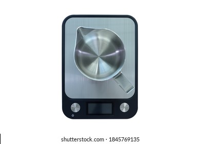 top view photo of the stainless steel pitcher pot is put on the digital scale for measurement the weight during coooking in the kitchen isolated on white background