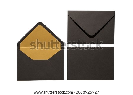 Top view photo of two open and closed stylish black envelopes and black paper sheet on isolated white background with blank space