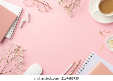 Top view photo of workspace cup of coffee on saucer computer mouse planners clips pencils glasses earbuds and white gypsophila flowers on isolated pastel pink background with empty space in the middle - Powered by Shutterstock