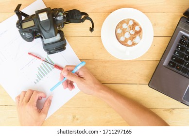 Top view of photographer workplace table with hot coffee