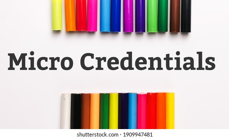 Top view phrase MICRO CREDENTIALS on white background with colorful pencils. Education concept. - Shutterstock ID 1909947481