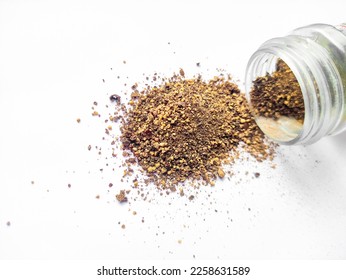 Top view picture of Black pepper spice pot is lying on white background.Black pepper spice powder over white background. - Shutterstock ID 2258631589