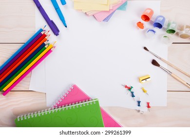 Top View Of Piece Of Paper And School Supplies On The  Wood Background