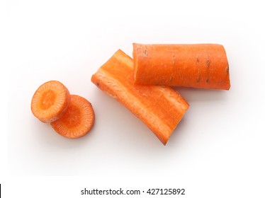 Top View Of Pieces And Slices Of Carrot On The White Background