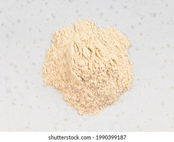 Top View Of Pile Of Apple Pectin Powder Close Up On Gray Ceramic Plate