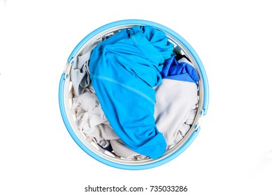 Top View For Pile Of Clothes In White Plastic Baskets On White Background Or Isolated