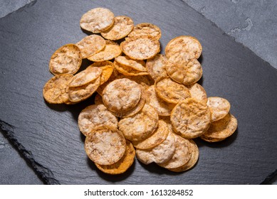 Top View Pile Of Organic, Crispy, Baked, Whole Grain Rice Chips 