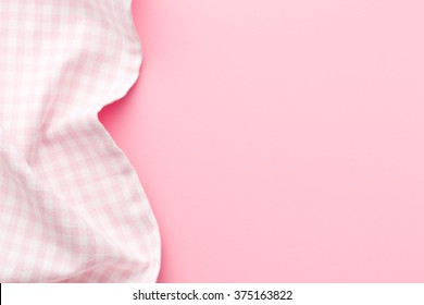 top view of pink checkered napkin on pink table - Powered by Shutterstock - Get 15% off with code: PIKWIZARD15
