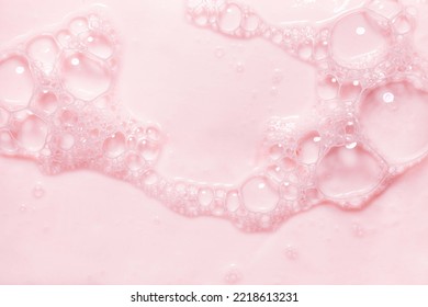 Top view pink soap bar wet with bubbles - Powered by Shutterstock