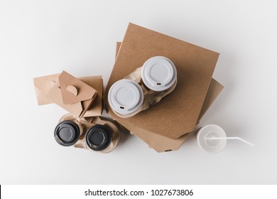 Top View Of Pizza Boxes And Coffee To Go With Food Containers On Tabletop