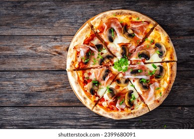 Top view of pizza speck with ham, mozzarella cheese and white mushrooms on wooden table  - Powered by Shutterstock