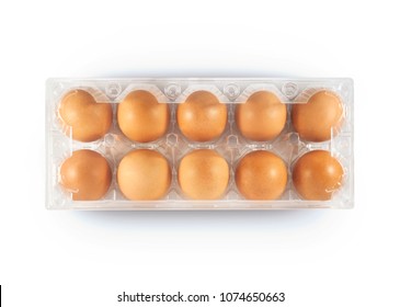 Top view of plastic egg tray with 10 eggs on white background