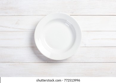 Top View Of Plate On White Wooden Table