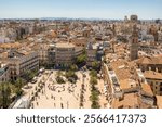 Top view of Plaza de la Reina square in central part of Valencia city, Spain. Valencia cityscape seen from the Bell tower of Valencia Cathedral at sunny day