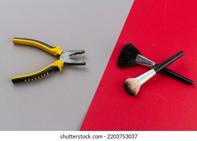 Top View Pliers And Two Makeup Brushes. Man Versus Woman Concept.