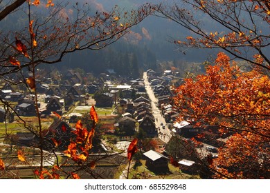 The Top View Point Of Shirakawago Village In Autumn, Japan. Gassho House Is World Heritage Site Of UNESCO. Create A Frame For Photos With Brightly Colored Trees.