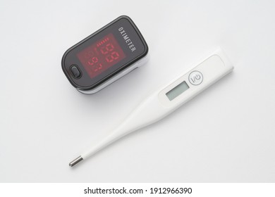 Top view of portable digital fingertip oximeter and thermometer 