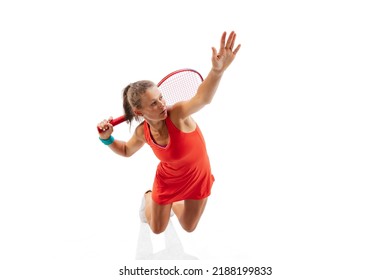 Top View Portrait Of Sportive Woman, Professional Tennis Player Hitting Ball With Racket, Training Isolated Over White Background. Concept Of Sport, Health, Strength, Action, Motion, Hobby, Lifestyle.