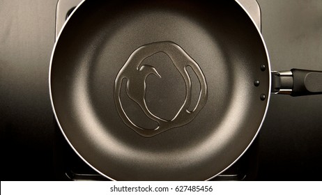 TOP VIEW: Poured Olive Oil On The Frying Pan