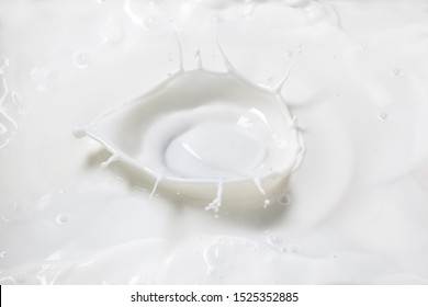 Top View Of Pouring Milk Splash With Crown. 