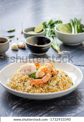 Top view Prawn fried rice served with traditional fish sauce mixed with Thai food, fusion of healthy Thai-Asian food concept