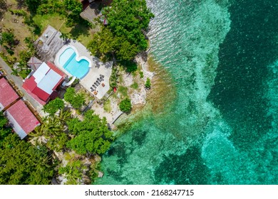 Top View Of A Private Boutique Resort With A Swimming Pool At The Coastline Of Pangangan Island, In Calape, Bohol, Philippines.