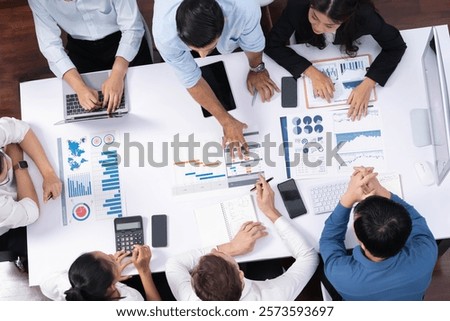 Top view project manager communicate and collaborate with team using project management software, tracking progress of project task and making schedule plan at meeting table. Prudent